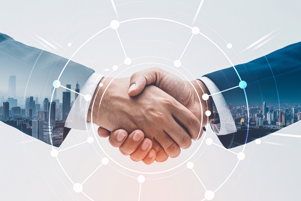 business-handshake-with-double-exposure-cityscape-digital-network-global-partnership-concept SRx Health in EMJX acquisition, names new chief executive